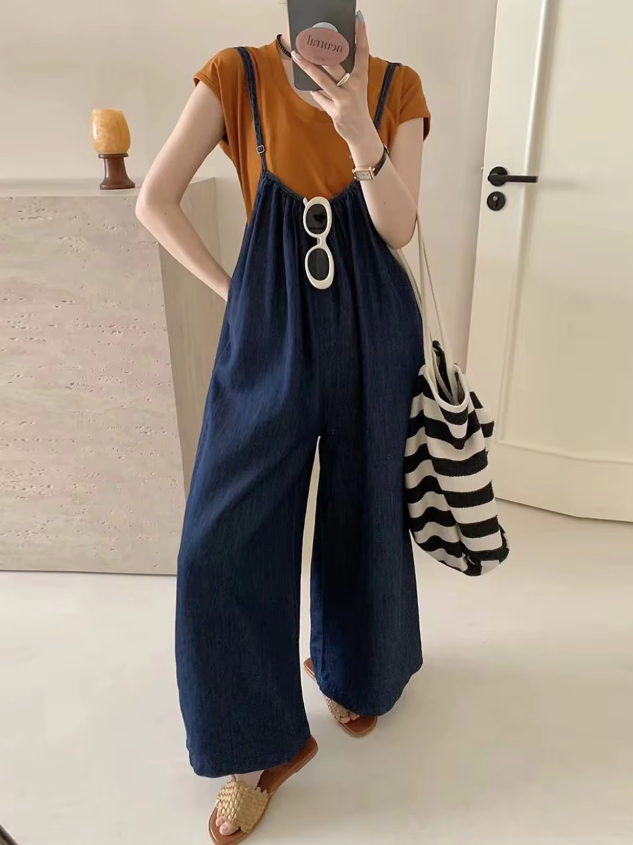 Okkerfarvet jumpsuit i denim til kvinder