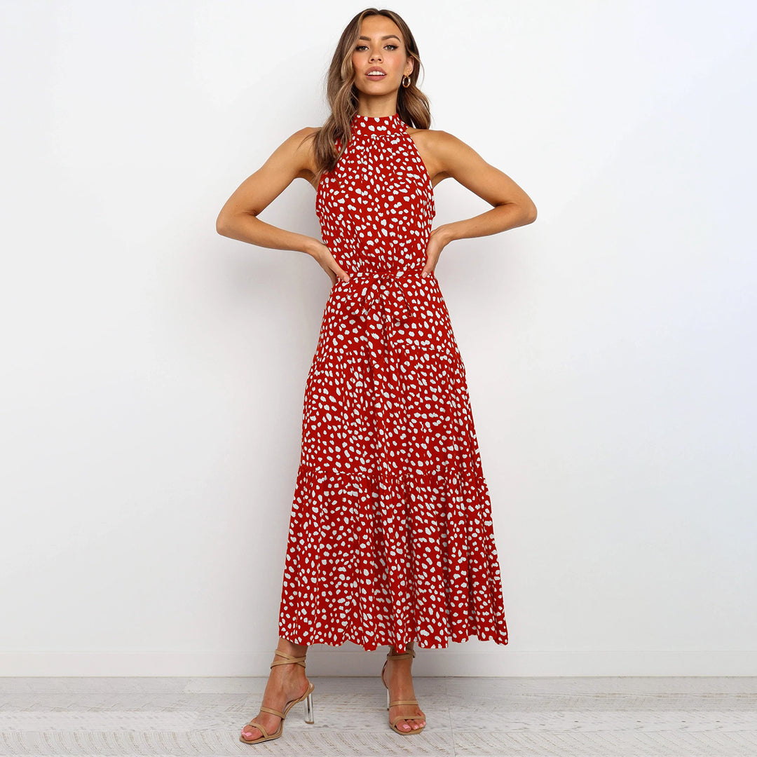 Elegant midikjole med halterneck og prikker