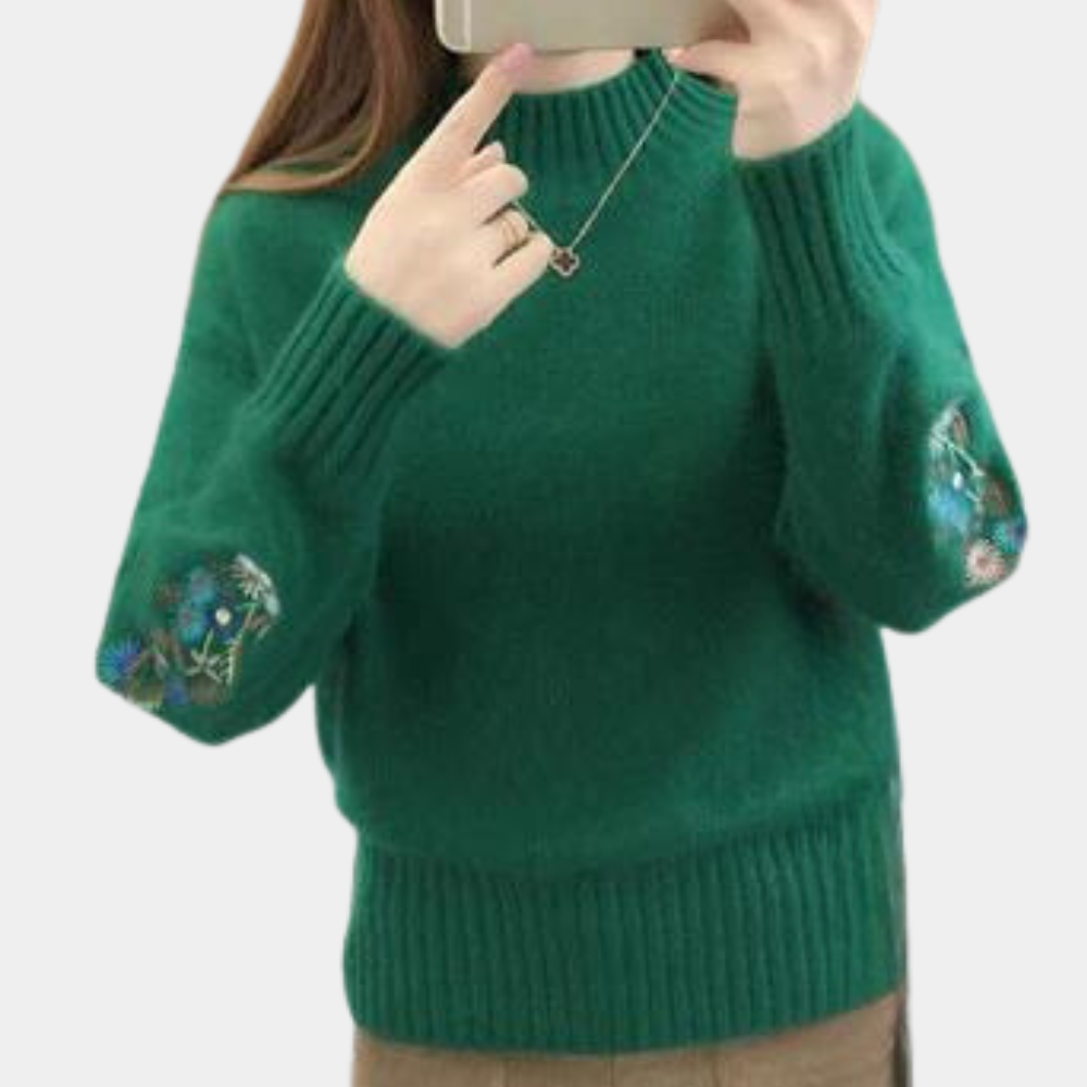 Blomst i ærmestrikket sweater