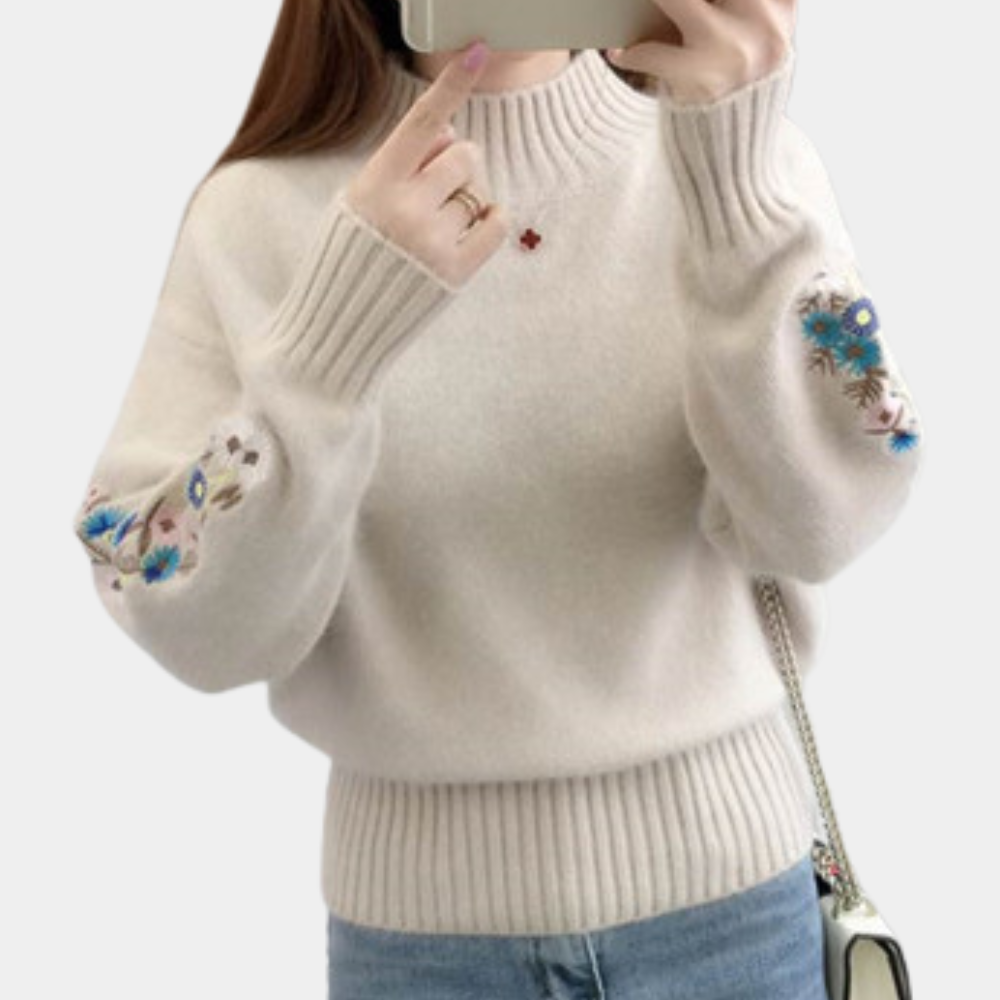 Blomst i ærmestrikket sweater