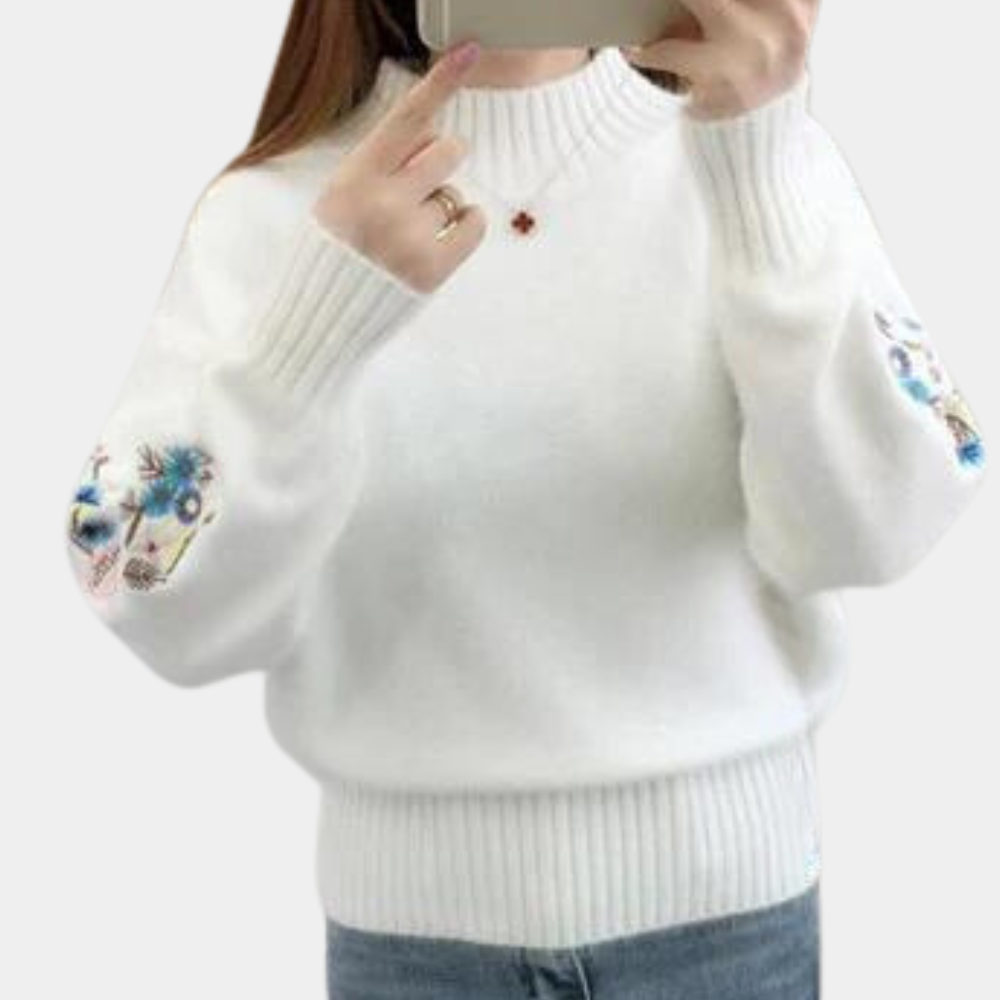 Blomst i ærmestrikket sweater