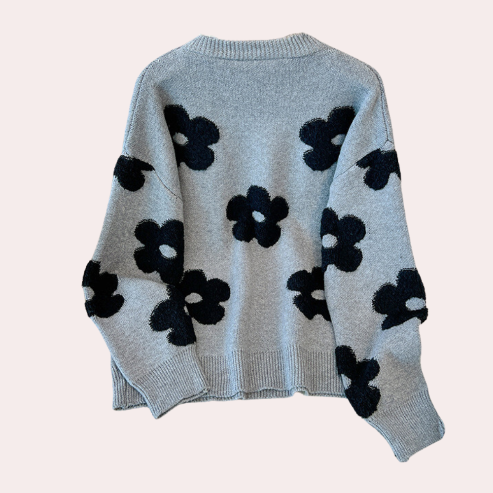 Strikket sweater med stiliserede blomster