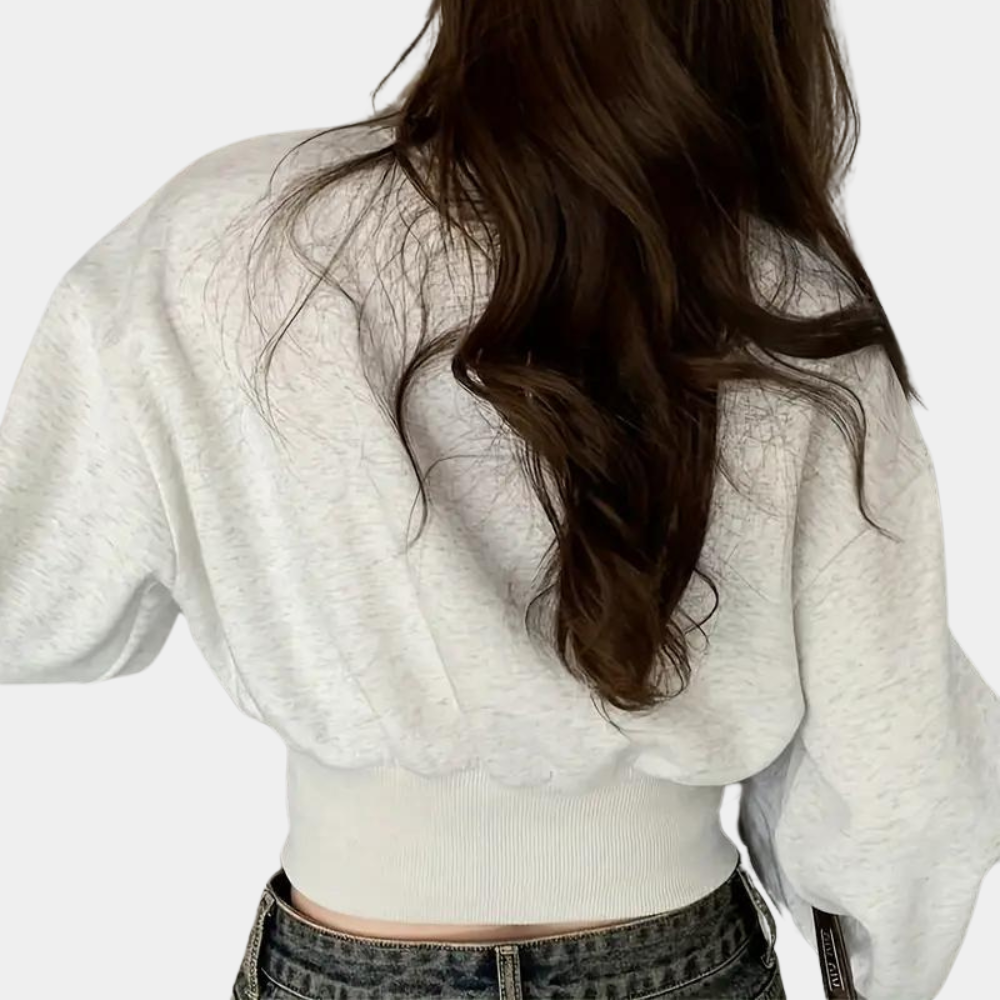 Sweater med pufærmer og knapper i taljen