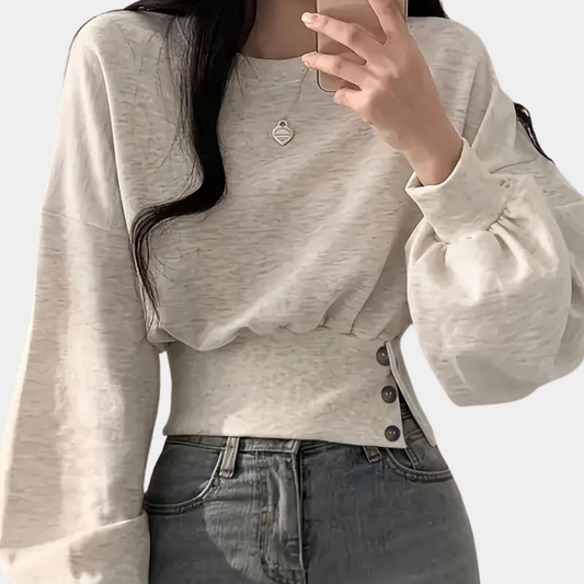 Sweater med pufærmer og knapper i taljen