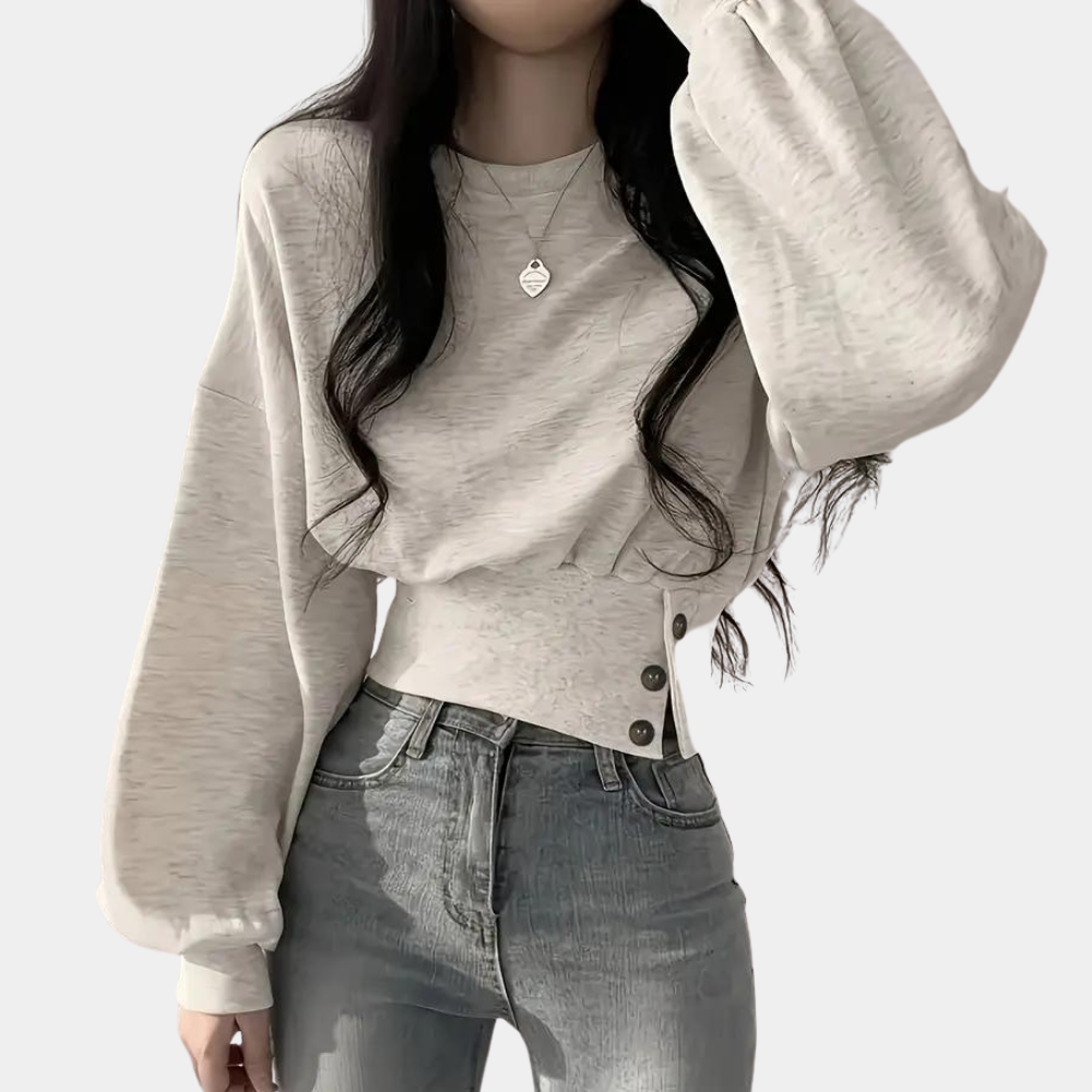 Sweater med pufærmer og knapper i taljen