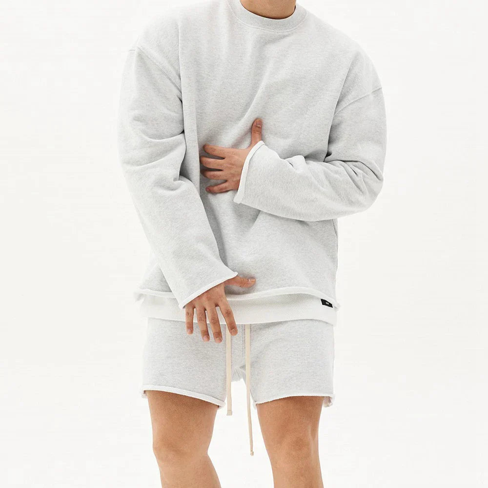 Sporty 2-delt sæt med langærmet top og shorts til mænd