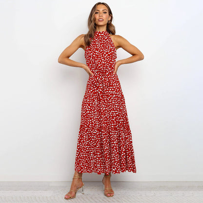 Elegant midikjole med halterneck og prikker