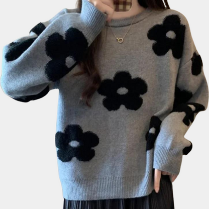 Strikket sweater med stiliserede blomster