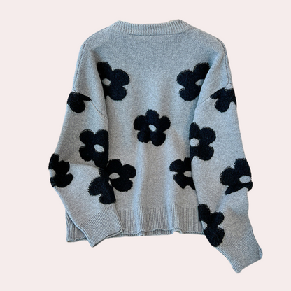 Strikket sweater med stiliserede blomster