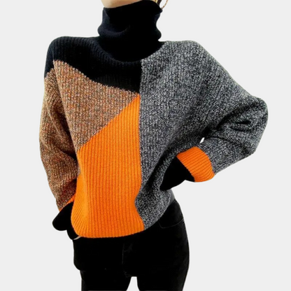 Rullekravesweater i geometriske farver