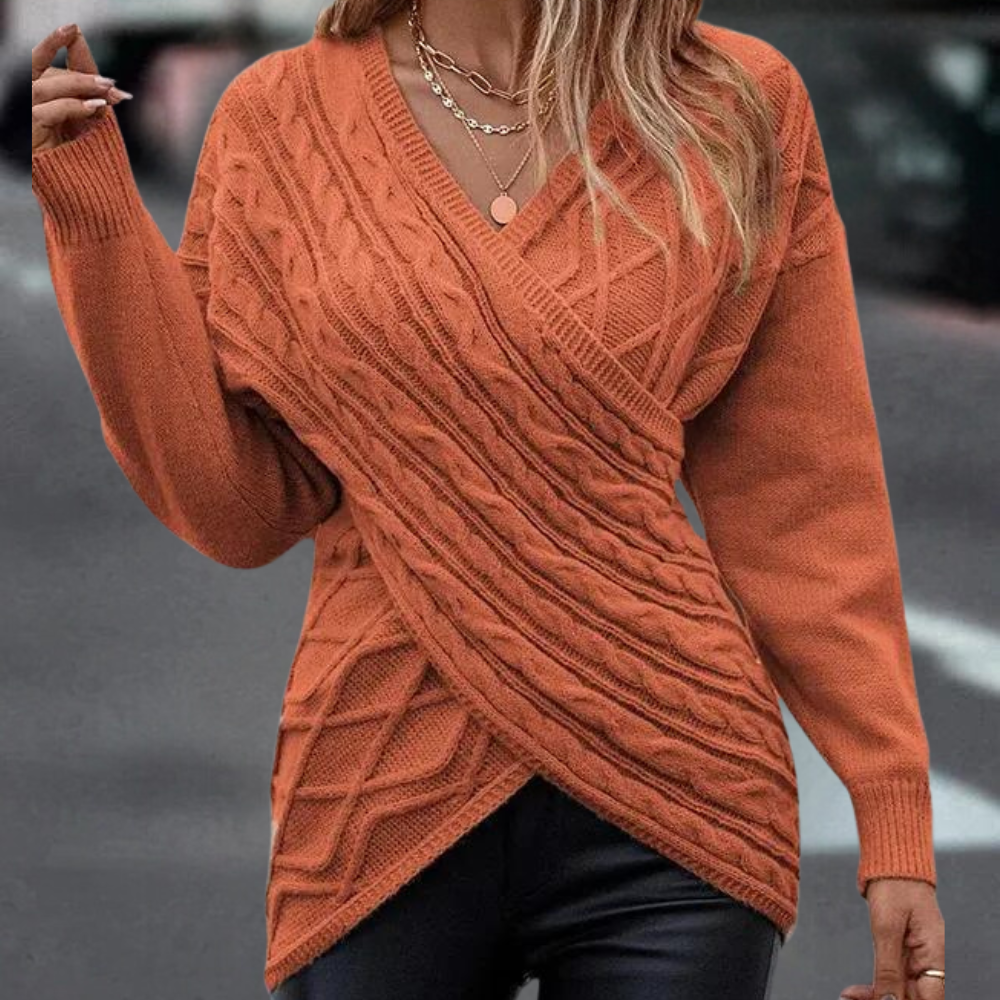 Strikket sweater med kryds og bolle