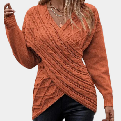 Strikket sweater med kryds og bolle