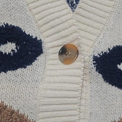 Løs strikket cardigan med åbne masker