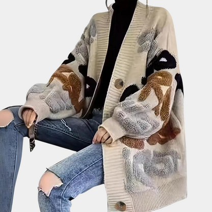 Løs strikket cardigan med åbne masker